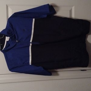 Fila golf shirt blue white and black short sleeved.